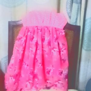 A pink floral dress  the brand is real love and the size is large 10 12